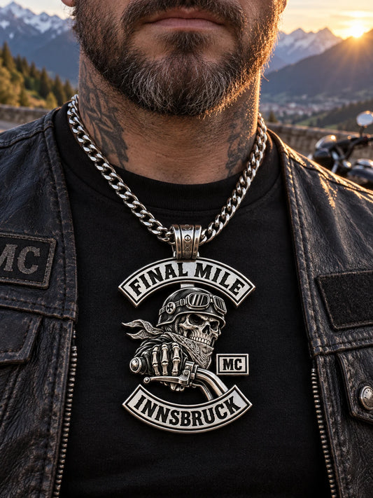Final Mile custom stainless steel motorcycle club pendant worn by a mature rider at a mountain turnout.