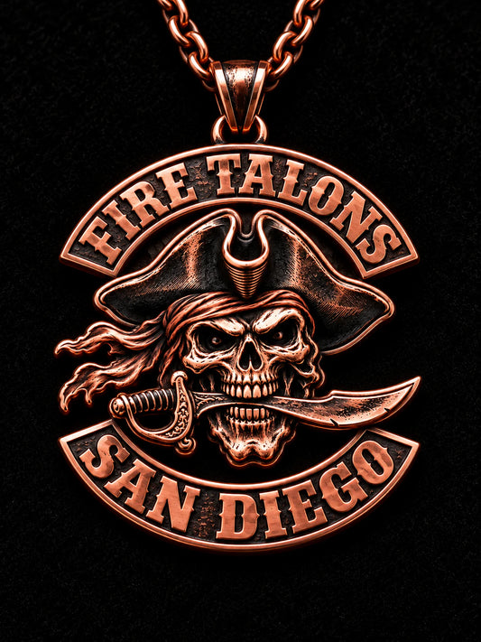 Fire Talons motorcycle club pendant with polished pure copper relief and dark recesses.