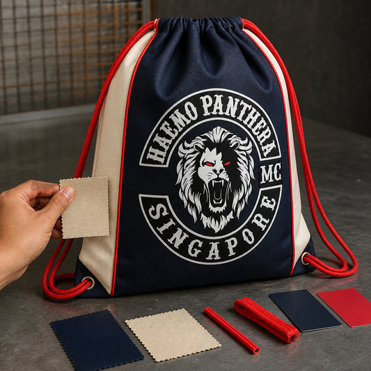 A motorcycle rally organizer reviews a full custom club-logo drawstring bag and artwork proof.