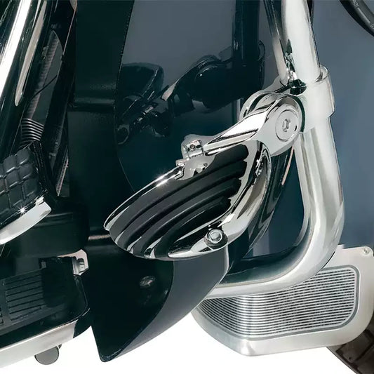 Chrome half-round highway cruise foot peg installed on a compatible Harley motorcycle