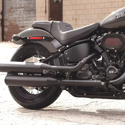 Passenger foot peg support bracket installed on a Harley Softail