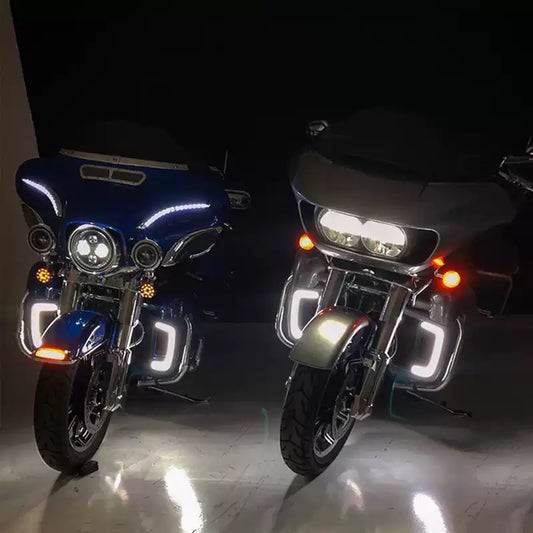 Engine guard LED lights installed on two Harley Touring motorcycles