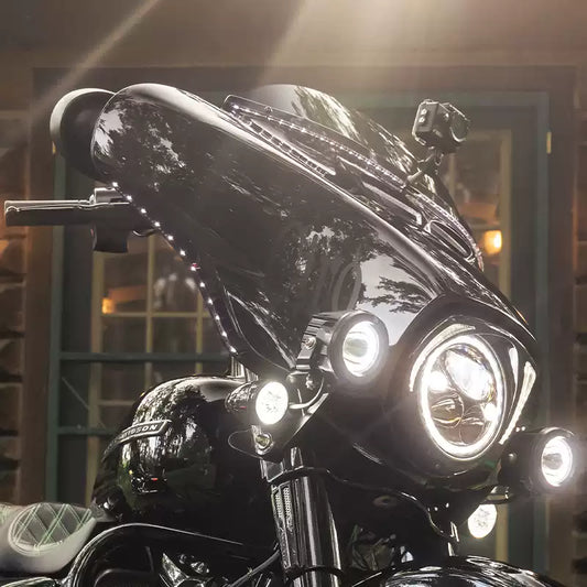 LED eyebrow light strips installed along a Harley Touring front fairing