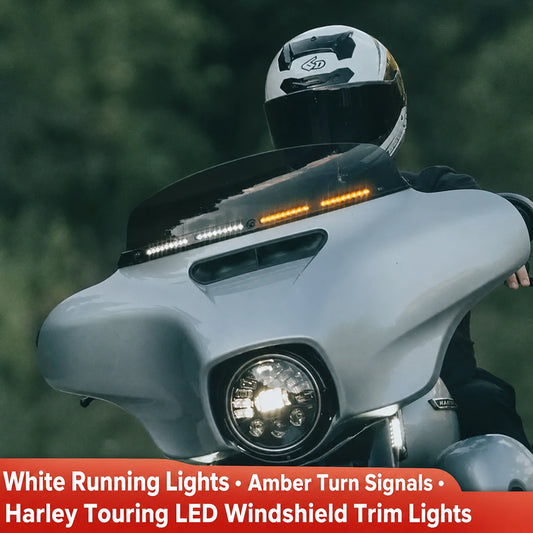 Harley Touring LED windshield trim lights installed with white running lights and amber turn signals