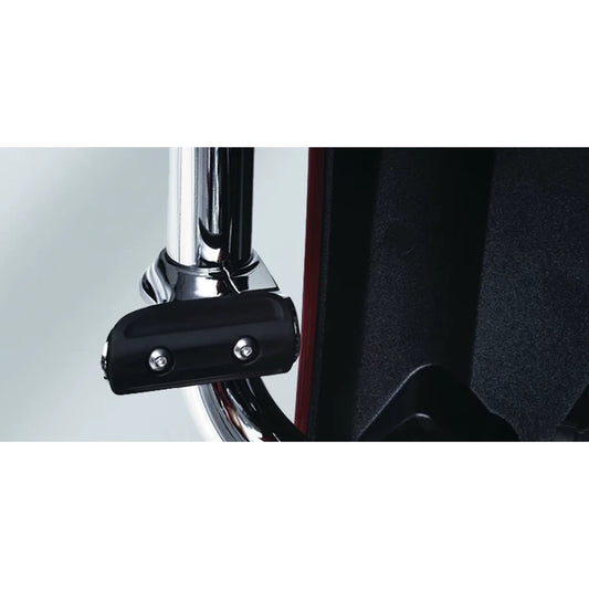 Black clamp-mounted highway cruise foot peg on a motorcycle engine guard