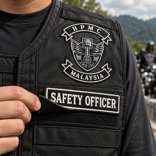 Removable hook-and-loop motorcycle club officer patch and backing.