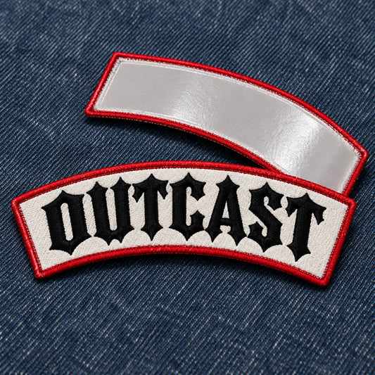 Front and back views of an iron-on name bar, clearly showing the smooth heat-seal adhesive backing on dark denim fabric, showing custom motorcycle club name bar patch options.