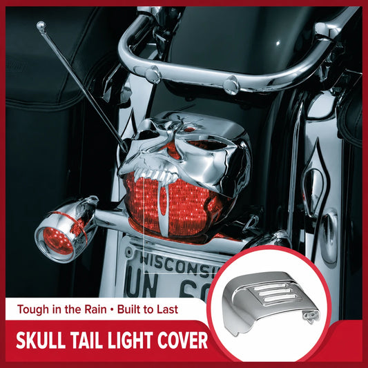 Chrome skull tail light cover installed on a Harley-Davidson motorcycle