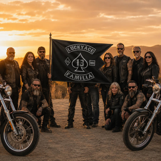 Adult motorcycle club members celebrating a milestone around a commemorative custom swallowtail flag.
