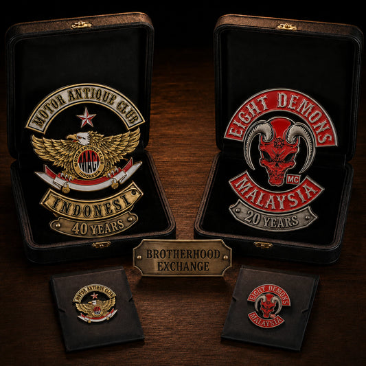 Motor Antique Club Indonesia and Eight Demons Malaysia anniversary badges displayed as a brotherhood exchange presentation set.