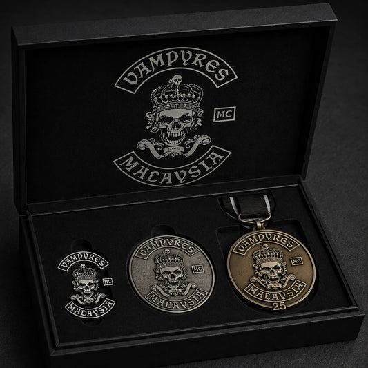Motorcycle club anniversary presentation set with an official-logo pin, challenge coin and medal.