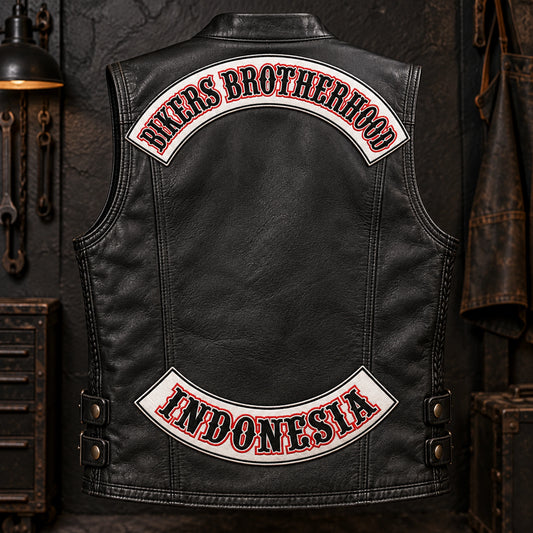 Complete black leather motorcycle vest displaying bold block lettering on custom motorcycle club top and bottom rocker patches.