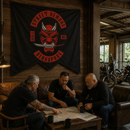 Custom motorcycle club swallowtail flag decorating a timber clubhouse lounge where riders plan a route.