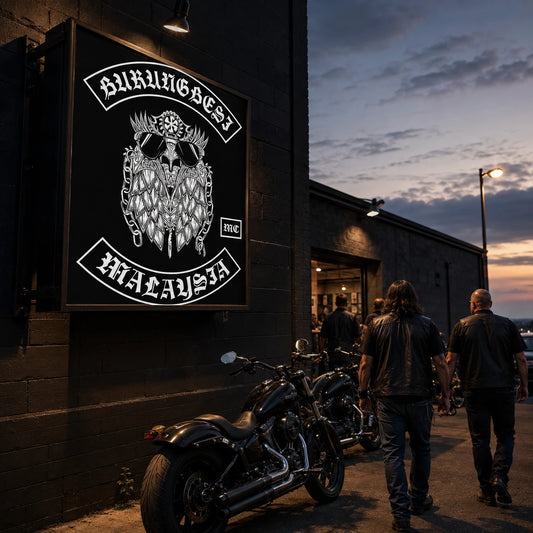 Custom motorcycle club entrance sign identifying a chapter meeting space at dusk.
