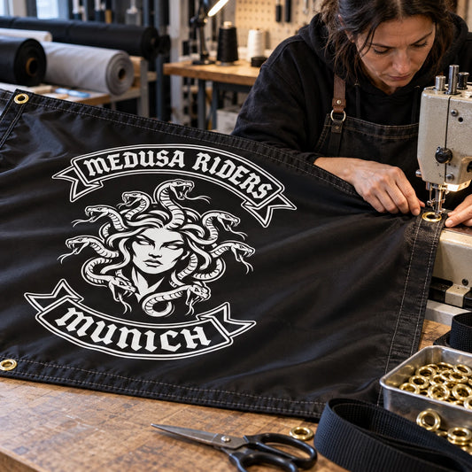 Motorcycle club members use a custom rectangular flag for finishing details in a realistic American V-twin setting.