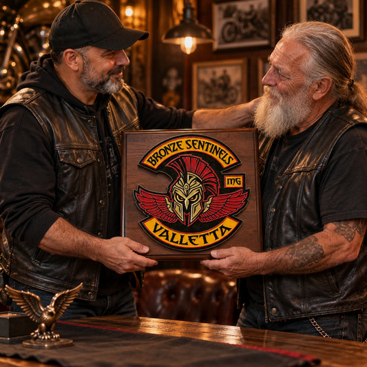 Motorcycle club founder receiving a custom recognition plaque at the clubhouse.