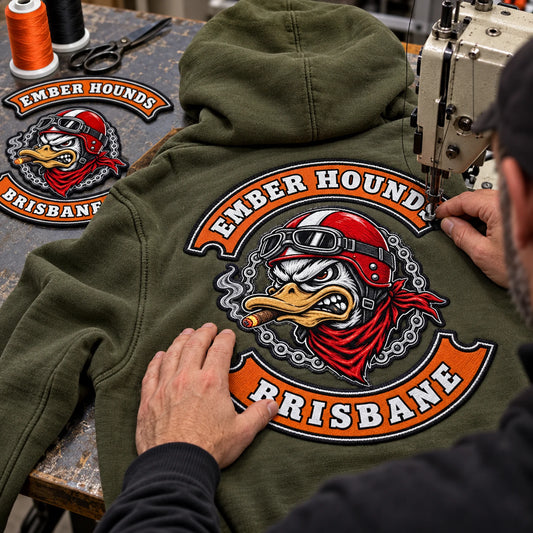 Sewn-on club patches featuring a custom motorcycle club hoodie with authorized club artwork.