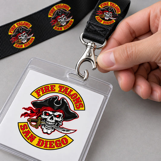 A hand opening the trigger hook attached to a Fire Talons motorcycle club lanyard.
