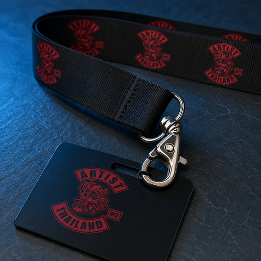 A metal swivel hook connecting a printed motorcycle club lanyard to a reinforced credential slot.