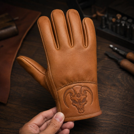 A tan leather club glove carries a compact debossed symbol from the approved artwork.