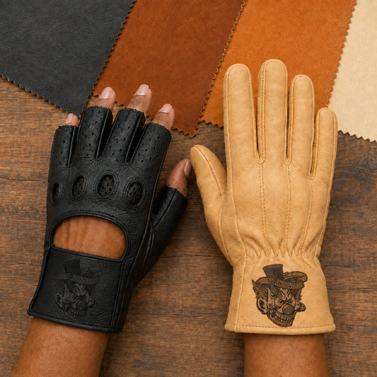 A buyer compares black fingerless and tan full-finger motorcycle club gloves with tonal laser-engraved cuff emblems.