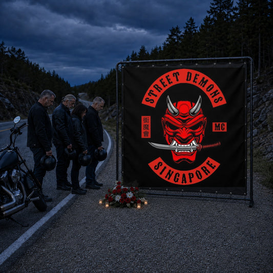 Motorcycle club riders standing respectfully beside a custom memorial ride banner.
