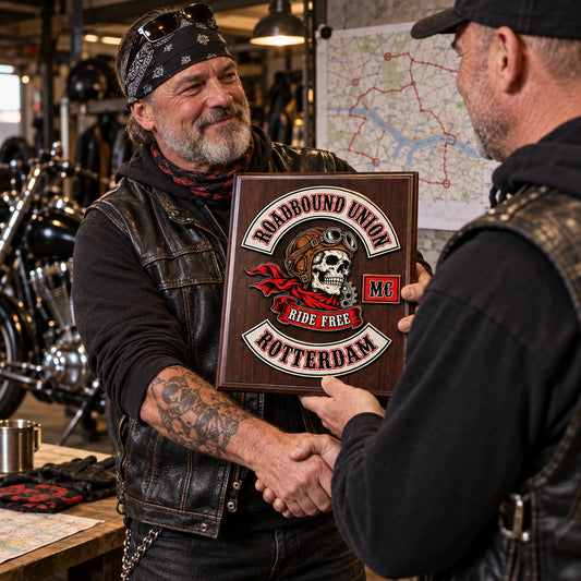 Custom motorcycle club officer plaque recognizing a road captain during a route briefing.
