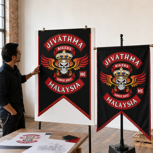 Designer presenting a custom motorcycle club swallowtail flag concept with a matching physical sample.