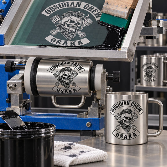 Rotary screen print fixture with blank bold emblem displaying an authorized logo for a custom motorcycle club metal mug project.