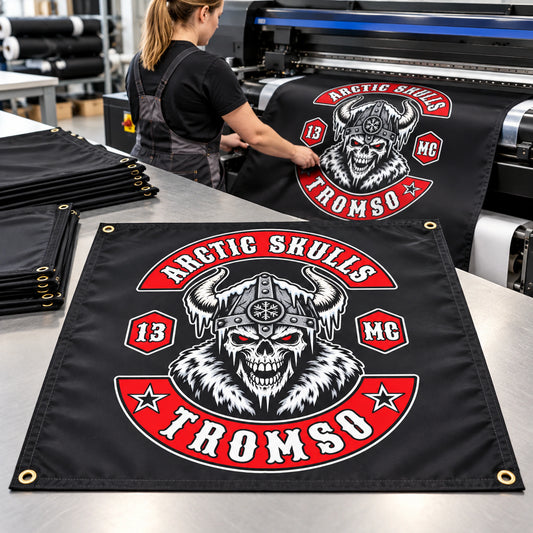 A textile operator produces custom Arctic Skulls square motorcycle club flags on professional equipment.