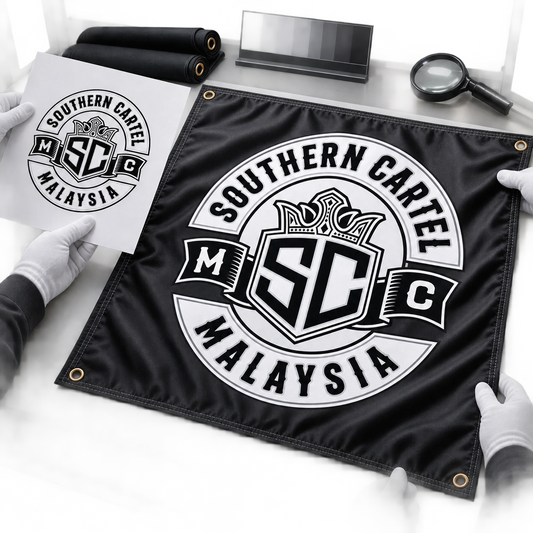 Gloved inspectors compare a color proof with a finished custom motorcycle club square flag.