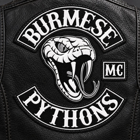 Custom motorcycle memorial patch sewn securely to a black leather vest.