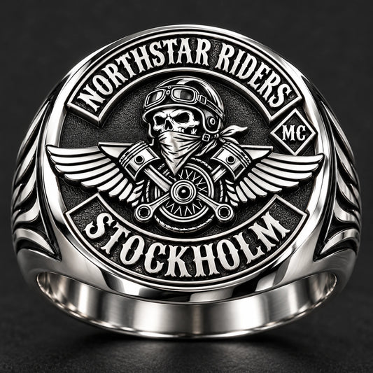 Polished stainless steel club ring with bright controlled highlights and crisp emblem edges.