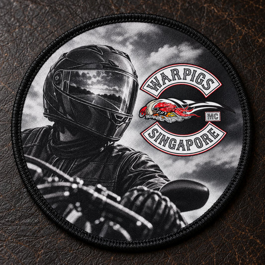 Printed motorcycle memorial patch with a non-identifiable illustrative rider portrait and finished border.