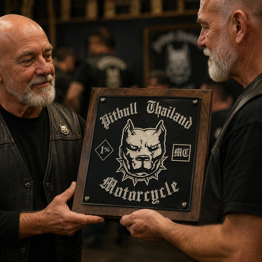 Founder receiving a custom motorcycle club recognition plaque at the clubhouse.