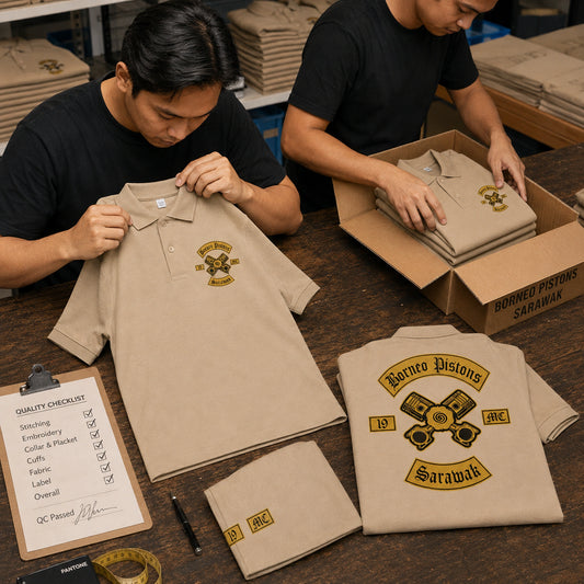 Workers inspect and pack tan Borneo Distons polos showing a left chest emblem, sleeve embroidery, large back logo, and marked inspection checklist.