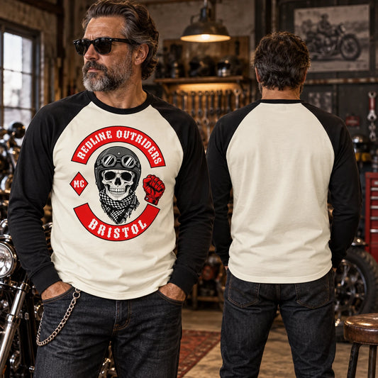 Custom motorcycle club raglan long-sleeve shirt with contrasting sleeves in a vintage garage.