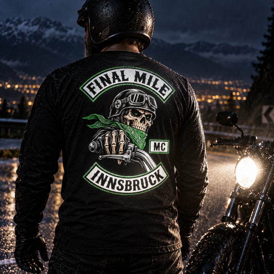 Reflective motorcycle club artwork illuminated on a custom long-sleeve shirt at night.