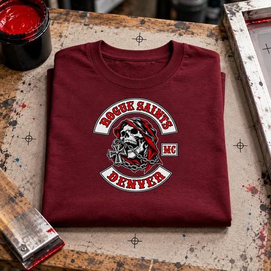 Rogue Saints supporter artwork centered on the front of a burgundy short-sleeve T-shirt.