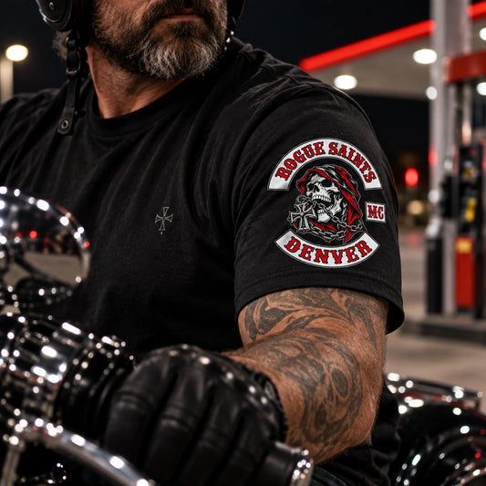 Compact Rogue Saints club emblem printed on the sleeve of a custom short-sleeve T-shirt.
