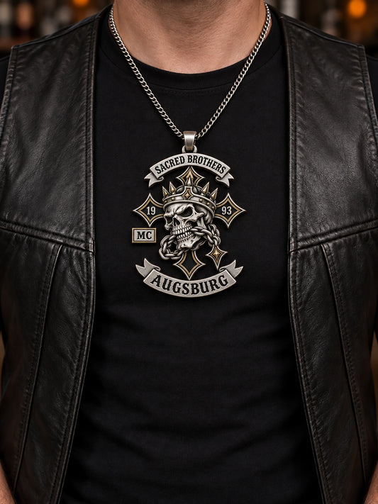 Sacred Brothers Augsburg statement motorcycle club pendant worn at a realistic 60 mm scale on the same rider's chest.