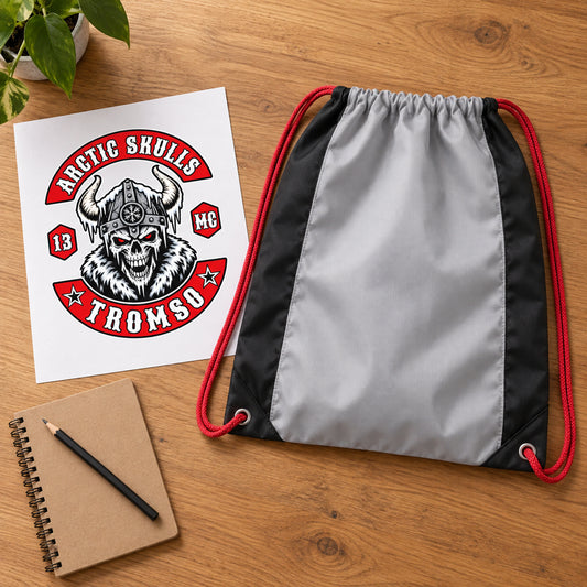 An Arctic Skulls motorcycle club logo sheet is placed beside a blank drawstring bag for artwork submission.