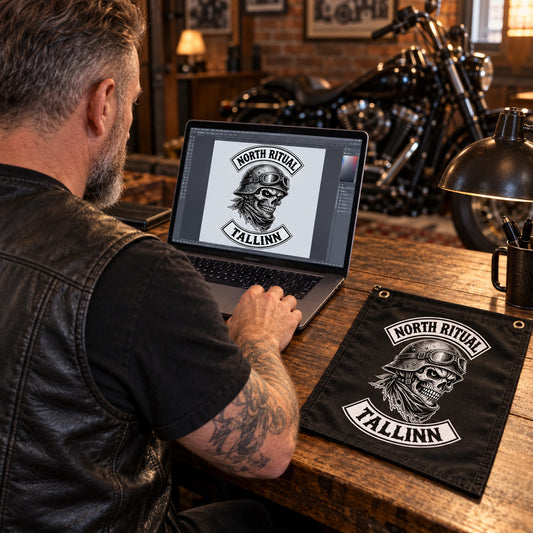 A motorcycle club secretary prepares an approved club logo file beside a physical flag reference.