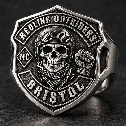 Shield-face stainless steel motorcycle club ring shaped around a crest-style emblem.