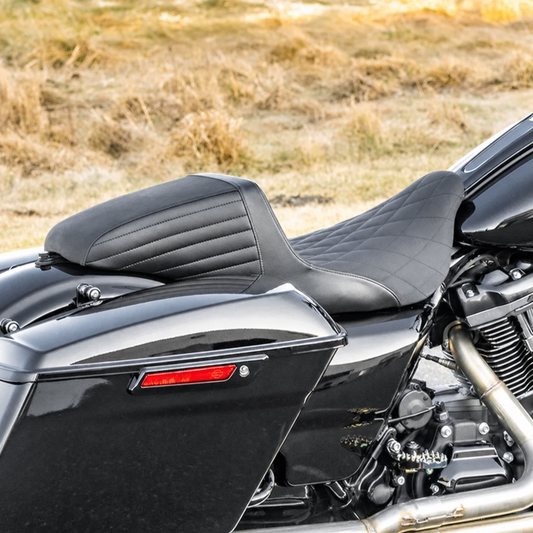 Rearward-position touring seat installed on a motorcycle