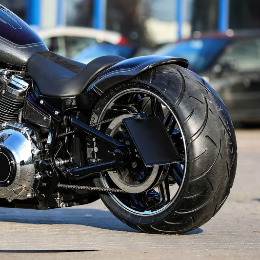 Wide rear tire conversion installed, side view