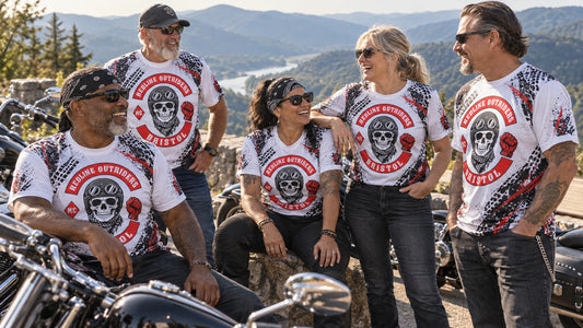 V-twin riding group wearing coordinated custom performance shirts at a mountain turnout.