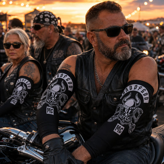 Custom motorcycle club arm sleeves worn at a sunset motorcycle rally