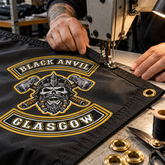 Sewing operator finishing the reinforced edge of a custom motorcycle club exchange flag.