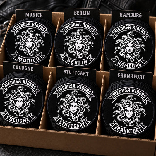 Motorcycle club bulk and chapter anniversary patch orders featuring the authorized Medusa Riders Munich identity in a bulk stacks sorted into chapter variants.